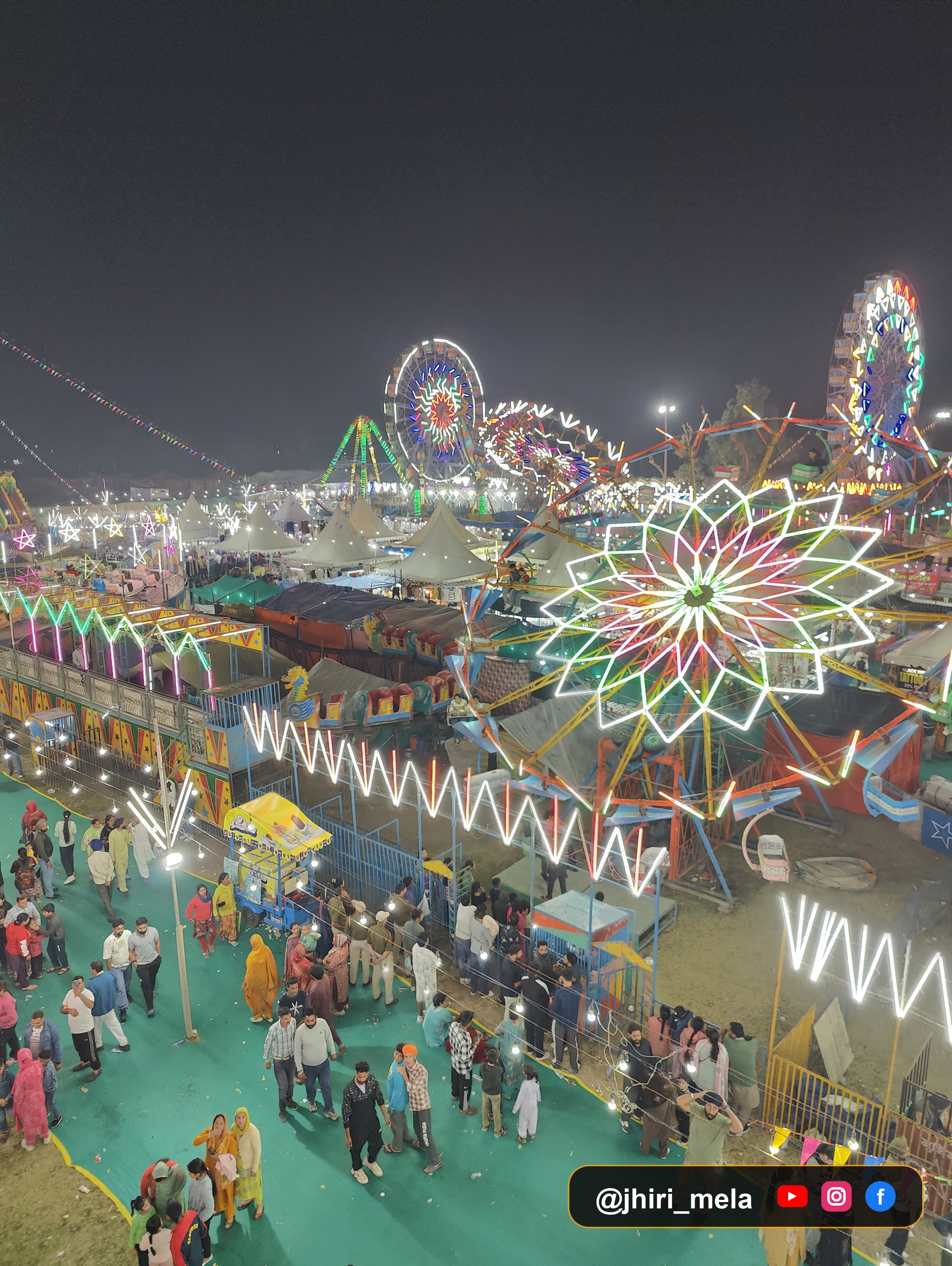 Vibrant Jhiri Mela Carnival & Giant Ferris Wheels at Night — झिरी मेला का जीवंत रात्रि दृश्य — झूले, रोशनी और जनसैलाब | Jhiri Mela Fairgrounds, Jammu